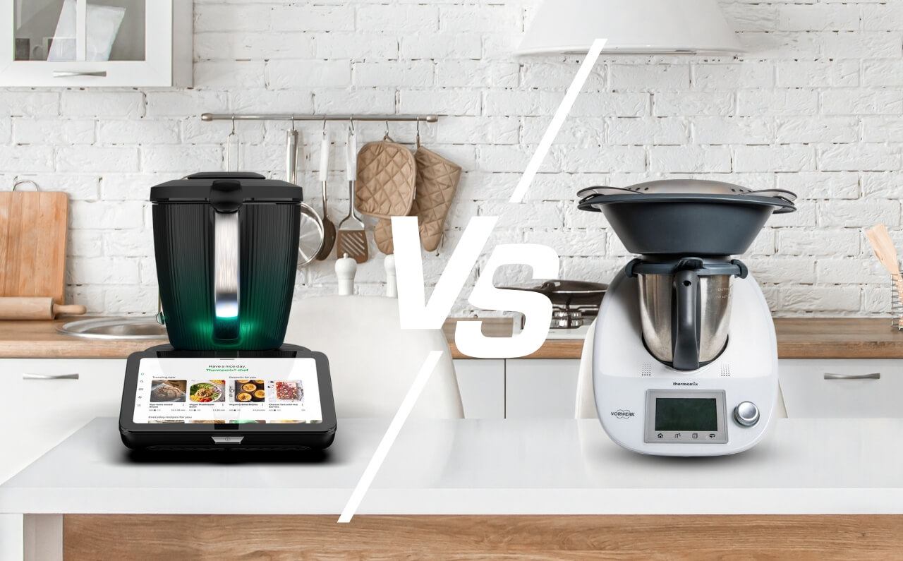 Thermomix 7 placed beside Thermomix 6 on a kitchen counter, showing design and interface differences between the two models.